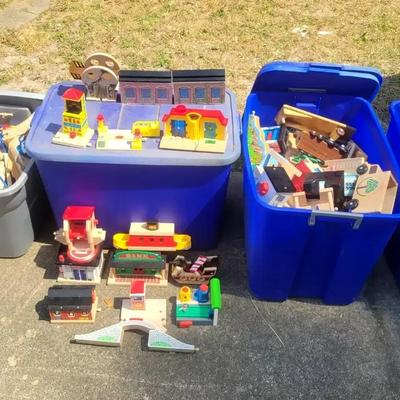 Storage Bins Filled with Wooden Train Toys