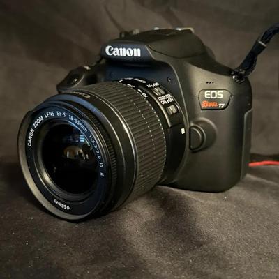 Lot 509: Canon EOS Rebel T7 DSLR Camera Bundle – 18-55mm Lens, Flash, & Carrying Case