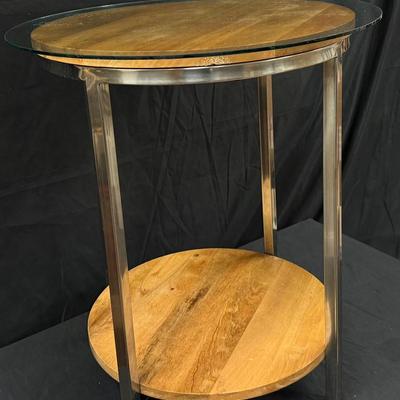 Lot 447: Modern Round Glass-Top Side Table with Wood Shelf and Metal Legs