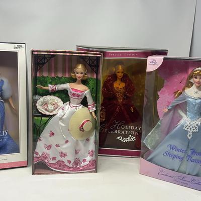 Taurus, Victorian Tea, and Holiday Celebration Barbie Dolls, and Disney Sleeping Beauty Doll