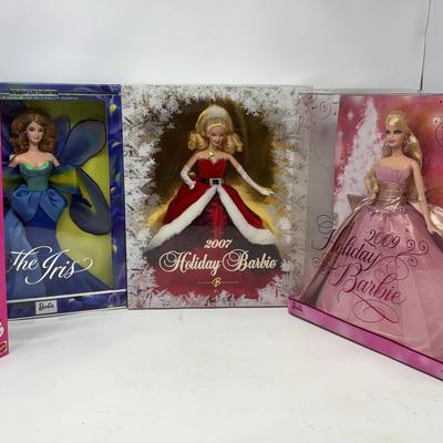 Parisian, The Iris, 2007 Holiday, and 2009 Holiday Barbie Dolls