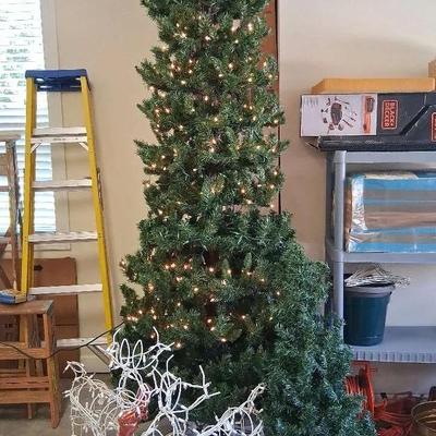 Two Lighted Christmas Trees with Reindeer Décor