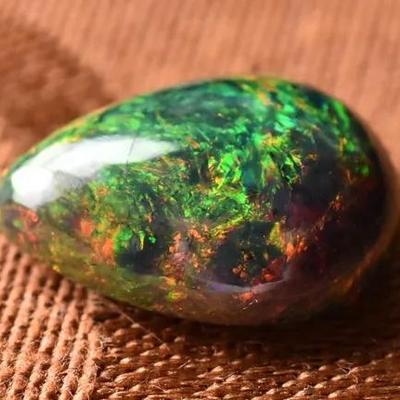 Insane 7.4 Carat Pear Black Opal Cabochon