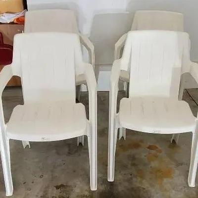 (4) Plastic Stacking Chairs with Cover