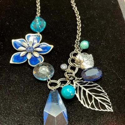 Necklace with blue enamel flower charm