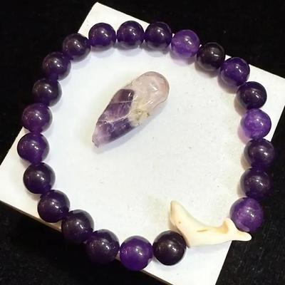 Amethyst beaded bracelet with dolphin bead accent