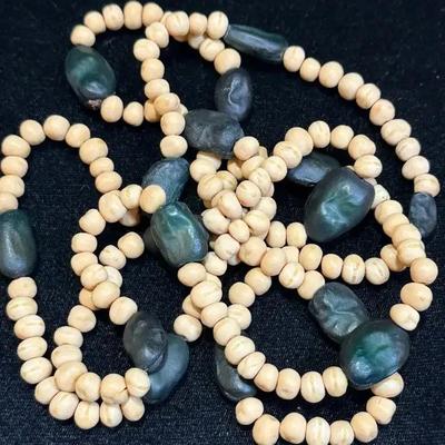 Necklace complementing bracelets
