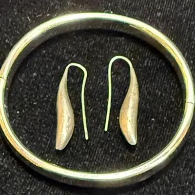 Silver earring complementing bracelet