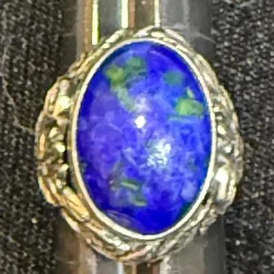 Oval lapis cabochon mounted on sterling with floral motif