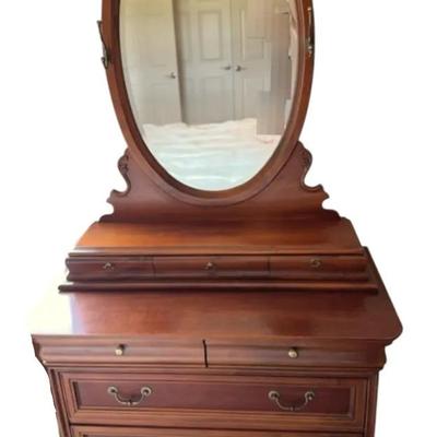 Wooden dresser with oval mirror 