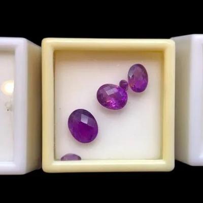Two 0.20CT Malaya Garnets, Purple Gemstones- Four Oval And One Round