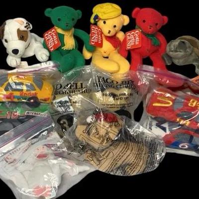 Variety Of Collectible Toys From Guns Bears To Taco Bell Chihuahua To NASCAR Race Cars