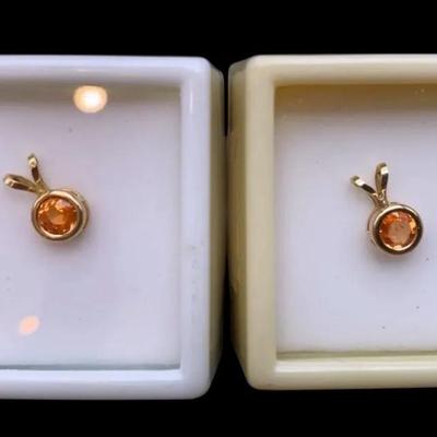 Two Spessarite Garnets: 0.45CT 5mm Round In Settings