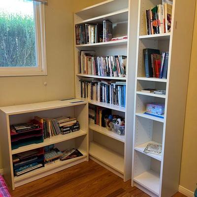White Bookshelves And Contents