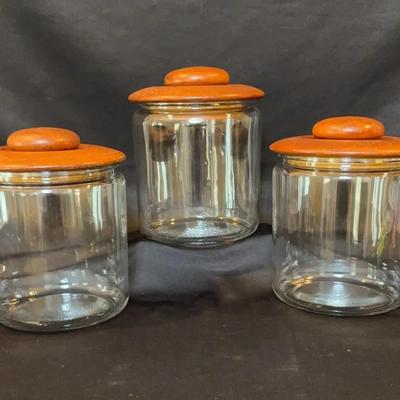 Three Large Canisters With Teak Lids