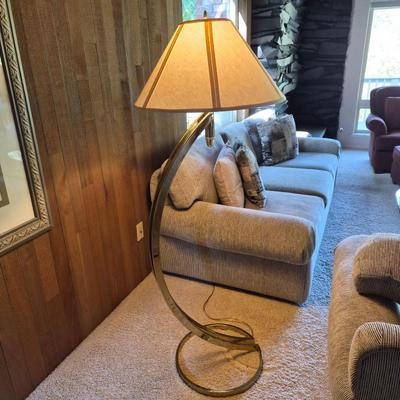 Sleek Curved Brass Floor Lamp