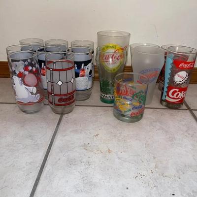 A Mix Of Coke Glasses 