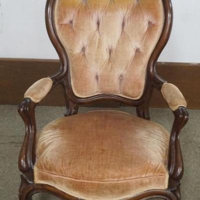 Sale Photo Thumbnail #213: 1213	WALNUT VICTORIAN CARVED PARLOR ARM CHAIR WITH TUFTED UPHOLSTERED BACK, APPROXIMATELY 26 IN X 25 IN X 43 IN H
