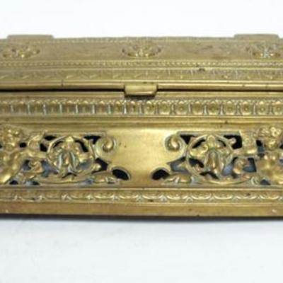 Sale Photo Thumbnail #2: 1002	ANTIQUE CAST BRASS DOUBLE INKWELL W/EMBOSSED IMAGES OF CHERUBS, APPROXIMATELY 14 IN X 8 IN X 3 IN HIGH
