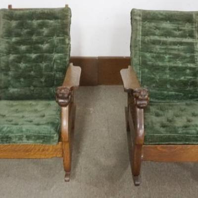 Sale Photo Thumbnail #192: 1192	PAIR OF UNUSUAL OAK MORRIS ROCKERS WITH LION HEAD CARVING AT ARM ENDS WITH TWIST COLUMN SIDES, EACH APPROXIMATELY 29 IN X 37 IN X 38 IN H
