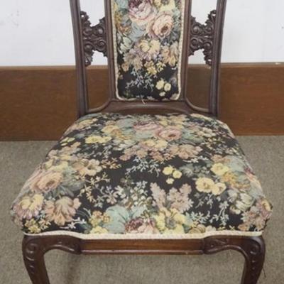 Sale Photo Thumbnail #197: 1197	VICTORIAN WALNUT UPHOLSTERED PARLOR CHAIR WITH CARVED HEADS AND NORTH WIND FACE AT SIDES AND CENTER, APPROXIMATELY 23 IN X 21 IN X 39 IN H
