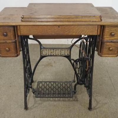 Sale Photo Thumbnail #172: 1172	ANTIQUE OAK SINGER TREADLE SEWING MACHINE, APPROXIMATELY 34 IN X 16 IN X 31 IN H
