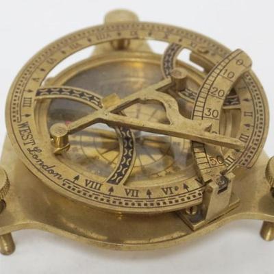Sale Photo Thumbnail #14: 1014	BRASS ENGLISH NAUTICAL COMPASS, APPROXIMATELY 5 IN X 2 IN HIGH
