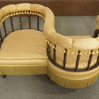 Sale Photo Thumbnail #216: 1216	VICTORIAN UPHOLSTERED TETE TO TETE COURTING CHAIR WITH TURNED SPINDLE AND HAVING TASSELS, APPROXIMATELY 45 IN X 29 IN X 27 IN H

