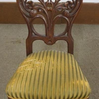 Sale Photo Thumbnail #203: 1203	FANCY WALNUT VICTORIAN FLORAL PIERCED CARVED PARLOR CHAIR, UPHOLSTERY HAS WEAR, APPROXIMATELY 17 IN X 18 IN X 41 IN H
