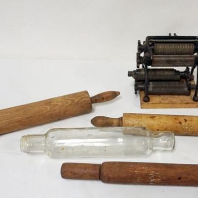 Sale Photo Thumbnail #115: 1115	PASTA CUTTER AND ROLLING PIN INCLUDING 1 GLASS, PASTA CUTTER APPROXIMATELY 7 IN X 6 IN X8 IN
