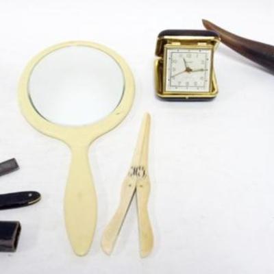 Sale Photo Thumbnail #28: 1028	GROUP OF ASSORTED ITEMS, RS PRUSSIA HAIR RECEIVER, STRAIGHT RAZOR, GLOVE STRETCHER, MIRROR, CARVED WHALE, TRAVEL CLOCK
