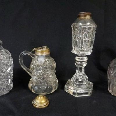Sale Photo Thumbnail #32: 1032	GROUP OF ASSORTED ANTIQUE FLINT GLASS, DECANTORS, KEROSENE LAMP & SYRUP, TALLEST PIECE APPROXIMATELY 11 IN HIGH
