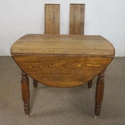 Sale Photo Thumbnail #174: 1174	OAK DROP LEAF TABLE WITH 2 LEAVES, APPROXIMATELY 42 IN X 28 IN X 30 IN H CLOSED, EACH DROP 13 IN AND EACH LEAF 7 IN
