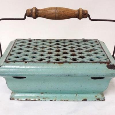 Sale Photo Thumbnail #57: 1057	CAST IRON GREEN ENAMELED FOOTWARMER, APPROXIMATELY 10 IN X 7 IN X 4 IN

