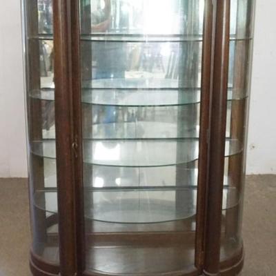 Sale Photo Thumbnail #165: 1165	OAK BOW FRONT, CURVED GLASS CRYSTAL CABINET WITH CORINTHIAN COLUMNS AND CARVED PAW FEET, APPROXIMATELY 48 IN X 20 IN X 66 IN H, 2 MIRRORS CRACKED
