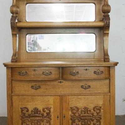 Sale Photo Thumbnail #176: 1176	OAK SIDEBOARD HAVING 4 DRAWERS, 2 DOORS, SCROLLED CARVED, PAW FEET AND DOUBLE MIRROR TOP, APPROXINATELY 48 IN X 23 IN X 87 IN H

