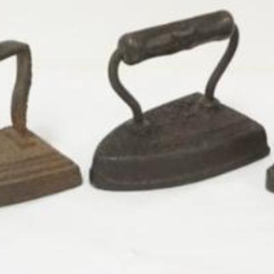 Sale Photo Thumbnail #77: 1077	GROUP OF ASSORTED ANTIQUE FLAT IRONS, ONE MARKED ENTERPRISE

