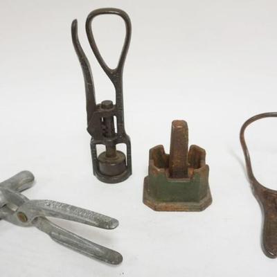Sale Photo Thumbnail #66: 1066	GROUP OF ASSORTED ANTIQUE METAL KITCHEN ITEMS, ALUMINUM *HARRY L HOSSMAN CHICKEN LEG MEAT PRESS, CAST IRON NUT CRACKER, BOTTLE CAPPER & BOOT JACK, TALLEST APPROXIMATELY 9 IN HIGH
