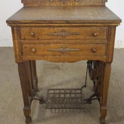 Sale Photo Thumbnail #175: 1175	ANTIQUE TREADLE SEWING MACHINE, *FREE SEWING MACHINE CO.*, APPROXIMATELY 27 IN X 18 IN X 34 IN H, PART OF METAL TABLE CASTING BROKE
