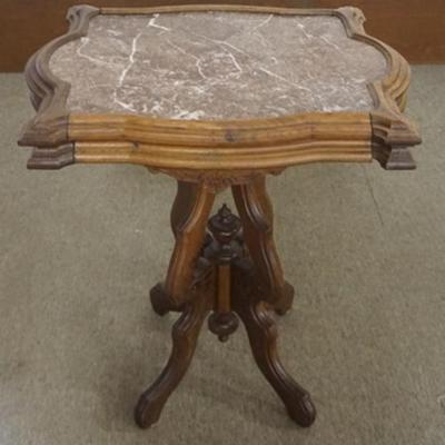 Sale Photo Thumbnail #214: 1214	WALNUT VICTORIAN MARBLE TOP PARLOR TABLE WITH BROWN INSET MARBLE TOP, APPROXIMATELY 26 IN X 19 IN X 30 IN H
