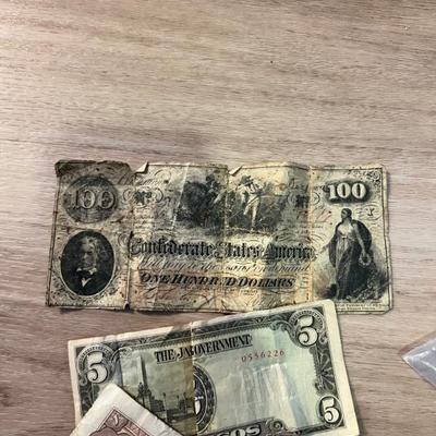 Confederate bill and foreign currency. 