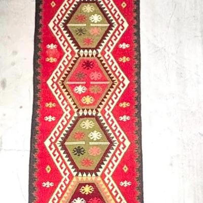 A 120” Handcrafted Kilim Rug 