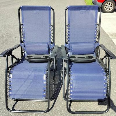 Two Outdoor Blue Lounge Chairs With Trays