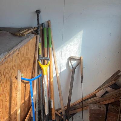 Assortment Of Bricks, Scrap Wood & Hand Tools: Saws, Shovels, Post Hole Digger & More