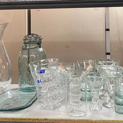 Assortment of Glassware Cups Pitchers and Flutes 