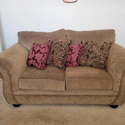 Traditional Tan Loveseat with Rolled Arms & Nailhead Trim | Includes Accent Pillows