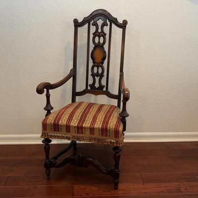 Antique Spanish Revival Armchair – Ornate Carved Wood Frame with Striped Upholstered Seat