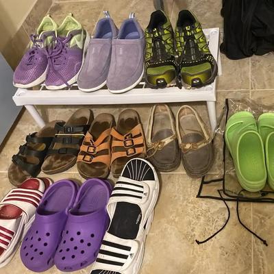 Assortment Of Women’s Shoes Sandals Running Shoes And Hiking Shoes