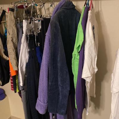 Assortment Of Fitness And Hiking Clothes With Vintage U Of A Tees And Overcoats