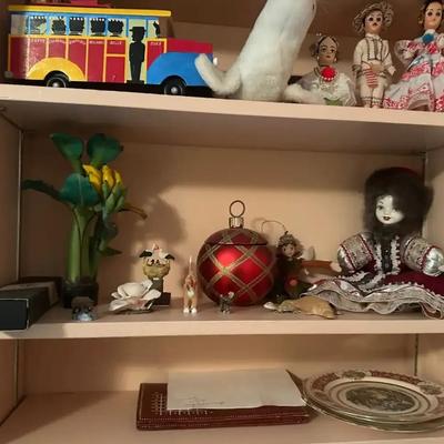 Shelves of Decorative Collectibles: Swarovski, Vintage Toys & More